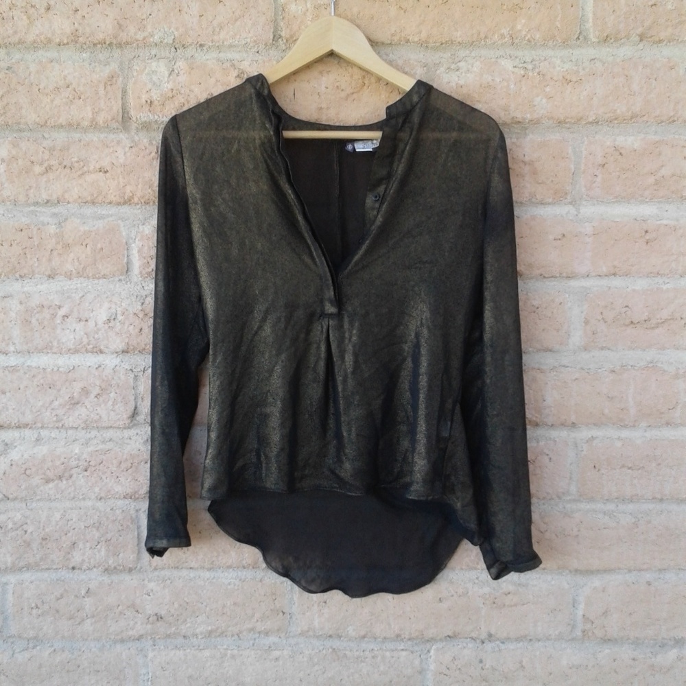 Jennifer Lopez black gold sheer blouse